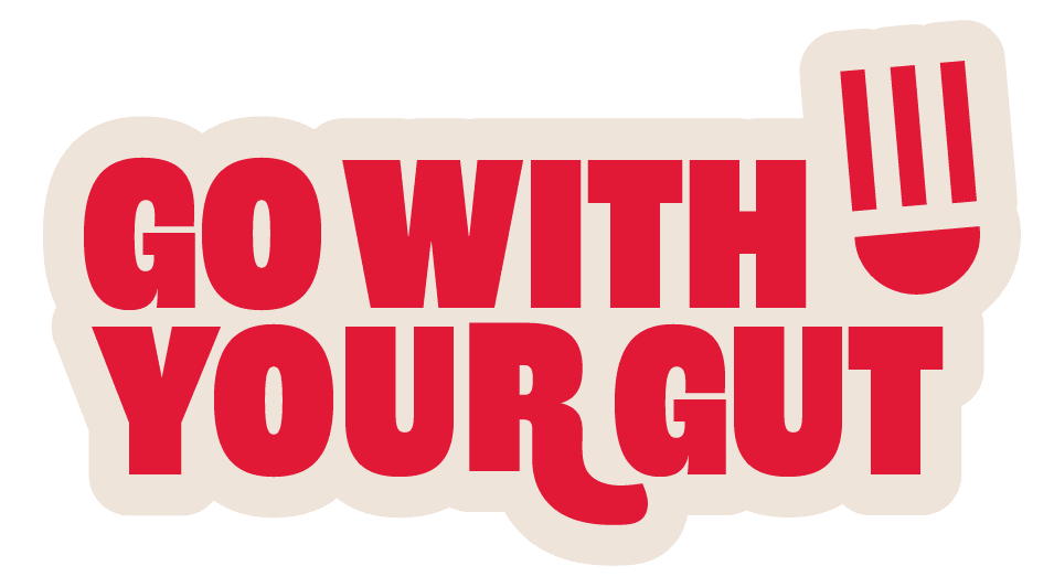 Bold red text reads “GO WITH YOUR GUT,” with the letter "U" in "GUT" stylized as a smiley face using three vertical lines for eyes. The text is on a light background.
